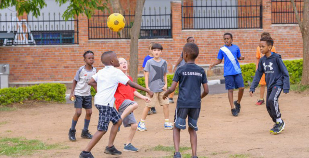 Students playing outside at the Kigali International Community School (KICS).